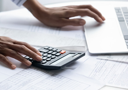 Person calculating their taxes